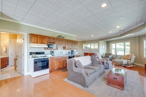 Relax in this spacious living area with a comfortable sofa set and a functional coffee table.
