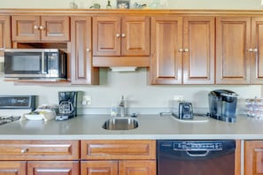 Enjoy cooking in this fully equipped kitchen with microwave, coffee maker, and dishwasher.