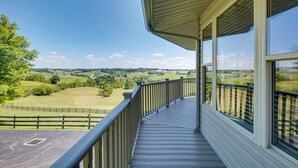 A covered outdoor balcony with a view of a green landscape. - Millersburg Getaway w/ Amish Country Views! (Millersburg)