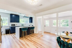 Enjoy cooking in this well-equipped kitchen with a central island and gas stove.