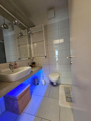 Shower, hair dryer, towels, soap