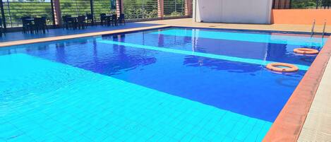 Outdoor pool, open 7:00 AM to 6:00 PM, lifeguards on site