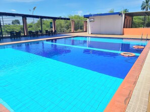 Outdoor pool, open 7:00 AM to 6:00 PM, lifeguards on site