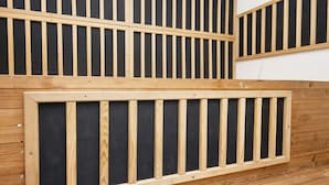 A room with a slatted wooden partition, a wooden floor, and a white wall. - 4 Star Holiday Home in Ulfborg (Ulfborg)