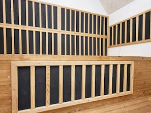 A room with a slatted wooden partition, a wooden floor, and a white wall. - 4 Star Holiday Home in Ulfborg (Ulfborg)