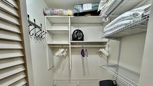 A walk-in closet with shelves, a fan, and baskets. - Sprawling ranch W/ HUGE Yard, Patio, & W/D (Wichita)