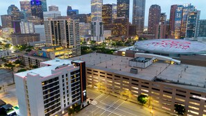 A multi-story parking garage with a Toyota Center in the background. - Tru by Hilton Houston Downtown Convention Center (Houston)