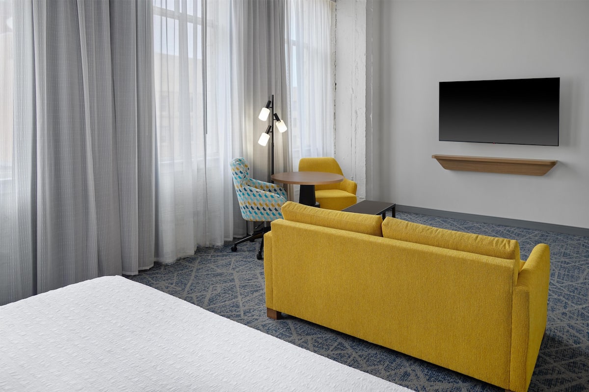 Room, 1 King Bed with Sofa bed, Refrigerator & Microwave | Living area | TV