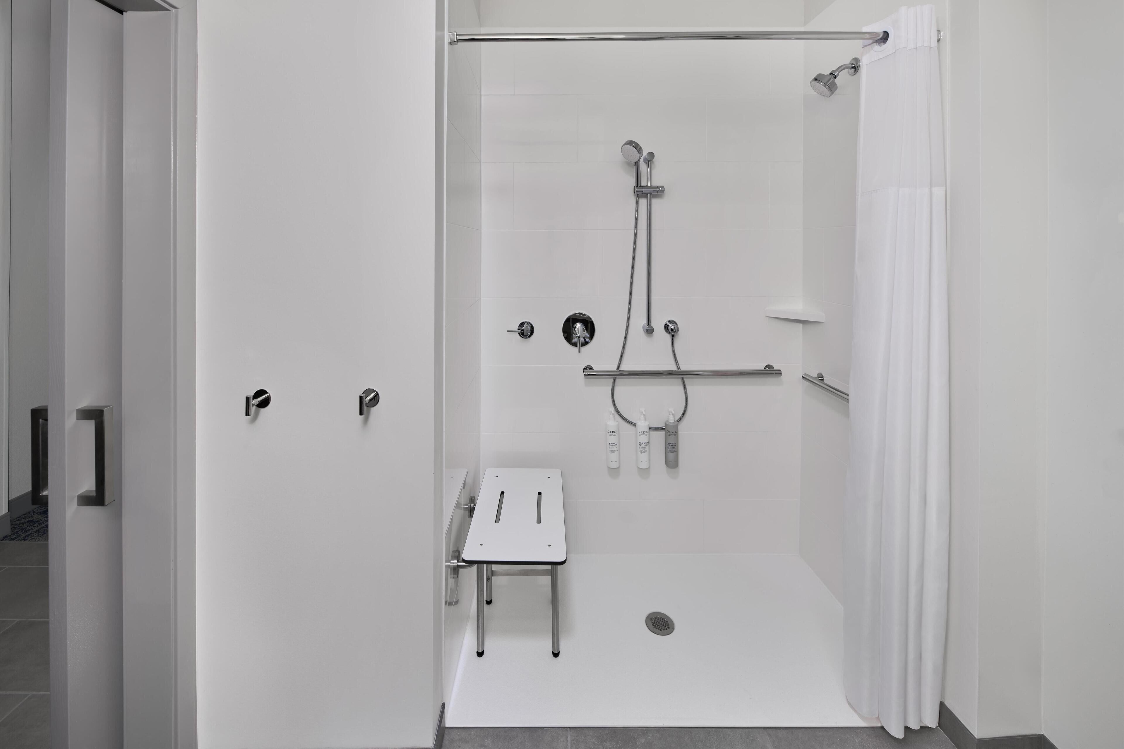 A modern shower area with a glass door, a handheld showerhead, a handheld showerhead, a handheld showerhead, a handheld showerhead, a handheld showerhead, a handheld showerhead, a handheld showerhead, a handheld showerhead, a handheld showerhead, a handheld showerhead, a handheld showerhead, a handheld showerhead, a handheld showerhead, a handheld showerhead, a handheld showerhead, a handheld showerhead, a handheld showerhead, a handheld showerhead, a handheld showerhead, a handheld showerhead, a handheld showerhead, a handheld showerhead, a handheld showerhead, a handheld showerhead, a handheld showerhead, a handheld showerhead, a handheld showerhead, a handheld showerhead, a handheld showerhead, a handheld showerhead, a handheld showerhead, a handheld showerhead, a handheld showerhead, a handheld showerhead, a handheld showerhead, a handheld showerhead, a handheld showerhead, a handheld shower