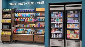 A grocery store with shelves stocked with snacks, beverages, and packaged foods. - Hampton Inn by Hilton Lincoln Downtown (Lincoln)