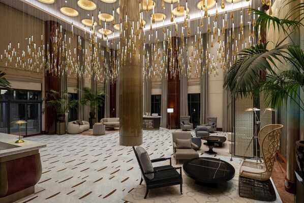 A spacious lobby with hanging chandeliers, comfortable seating, and a patterned floor. - Altunizade Suites Istanbul, Curio Collection by Hilton (Istanbul)