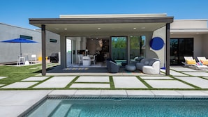 A modern house with a covered patio, a swimming pool, and outdoor seating. - Posh Private Panoramic View Compound w/Pool & Spa (Palm Springs)