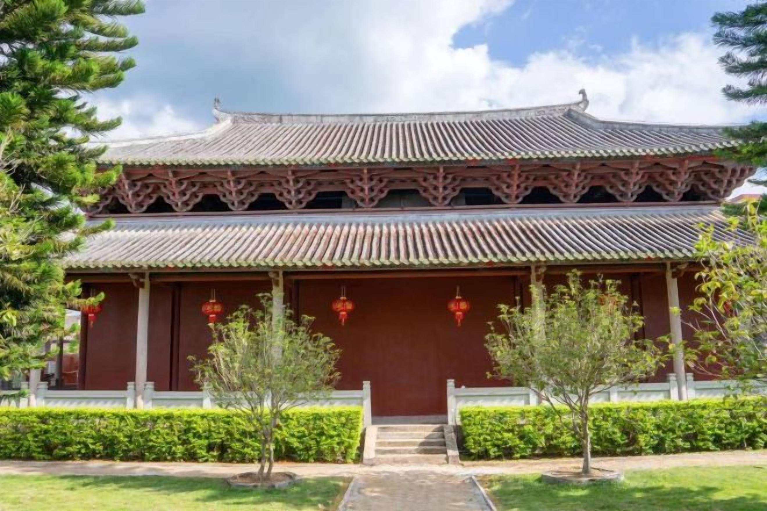 A traditional building with a tiered roof and a central entrance.