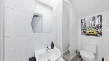 Shower, towels, soap, toilet paper