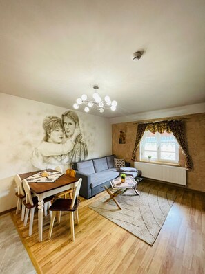 Villa Deluxe | Área de sala de estar | Consola de videojuegos y impresora 
