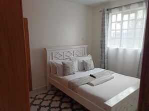 1 dormitorio, tabla de planchar con plancha, wifi gratis y ropa de cama