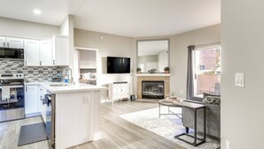 A modern kitchen with white cabinets, a built-in oven, and a microwave. - Sunny San Diego Condo w/ Pool Access Near Wineries (San Diego)