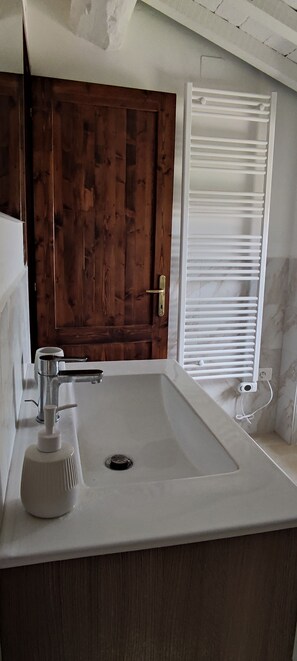 Shower, eco-friendly toiletries, hair dryer, bidet