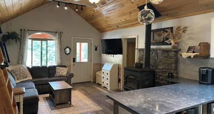 Entrance is right on HWY 89, tucked up under towering ponderosa pines, Whispering Pines Properties presents a luxurious step back in time. Originally built in 1960 by Tom Haycock, this ranchers cabin has been updated with all the comforts of a five