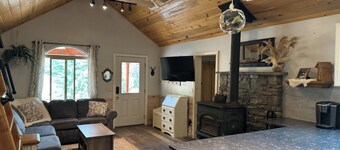 Entrance is right on HWY 89, tucked up under towering ponderosa pines, Whispering Pines Properties presents a luxurious step back in time. Originally built in 1960 by Tom Haycock, this ranchers cabin has been updated with all the comforts of a five