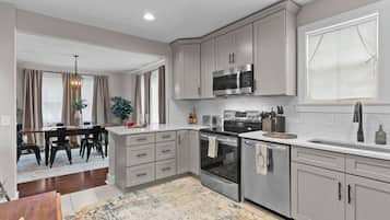 Fridge, coffee/tea maker, cookware/dishes/utensils