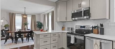 Fridge, coffee/tea maker, cookware/dishes/utensils