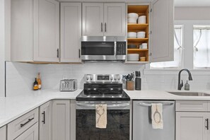 Fridge, coffee/tea maker, cookware/dishes/utensils