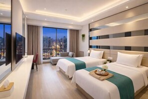 A modern hotel room with two beds, a large window with a city view, a flat-screen TV, and a desk with a chair. - Penguin Aurora City Hotel (Linhai Chonghemen) (Linhai)