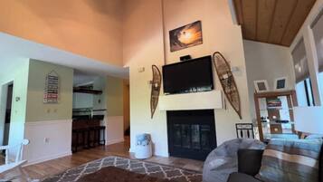 Smart TV, fireplace, foosball, books