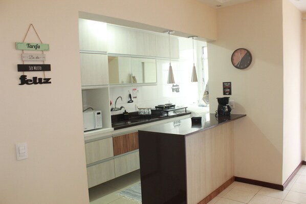 Fridge, microwave, stovetop, coffee/tea maker