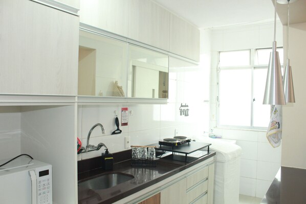 Fridge, microwave, stovetop, coffee/tea maker