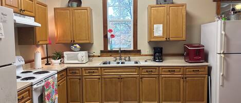 Fridge, microwave, stovetop, coffee/tea maker