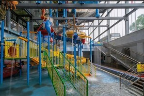 A multi-level indoor play area with various climbing structures and slides. - Zhangjiajie World Water Four Seasons International Hotel (Zhangjiajie)