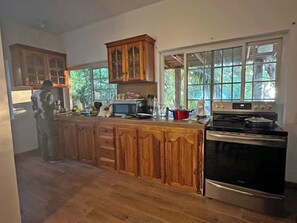 Fridge, microwave, stovetop, coffee/tea maker