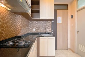 Apartamento | Cocina privada | Frigorífico, placa de cocina y arrocera