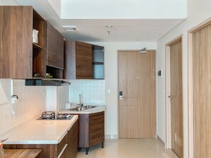 Apartment | Private kitchen | Fridge, stovetop, rice cooker, dining tables - Comfort And Well Furnished 2Br Tamansari Iswara Apartment (Bekasi)