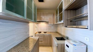 Apartment | Private kitchen | Fridge, stovetop, rice cooker, dining tables - Modern Look 2Br At Lucky Tower Residence Apartment (Jakarta)
