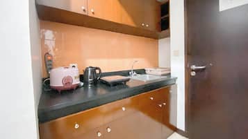 Mini-fridge, stovetop, rice cooker
