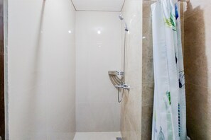 Deluxe Studio | Bathroom | Shower, free toiletries, towels - Homey And Relaxing Studio Transpark Bintaro Apartment (South Tangerang)