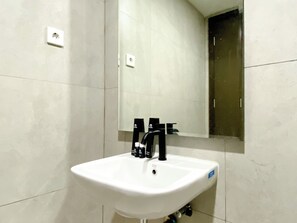 Deluxe Studio | Bathroom | Shower, free toiletries, towels, soap - Full Furnished And Homey Studio Pollux Chadstone Apartment (Cikarang)