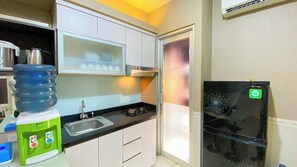 Apartment | Private kitchen | Fridge, stovetop, rice cooker, dining tables