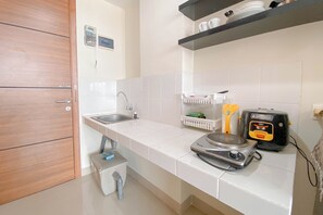 Private kitchen - Highrise Studio At Apartment Beverly Dago (Bandung)