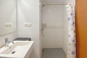 Studio | Bathroom | Shower, towels - Highrise Studio At Apartment Beverly Dago (Bandung)