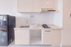 Apartment | Private kitchen - Best Place And Homey 2Br Sky House Bsd Apartment Near Aeon (Pagedangan)