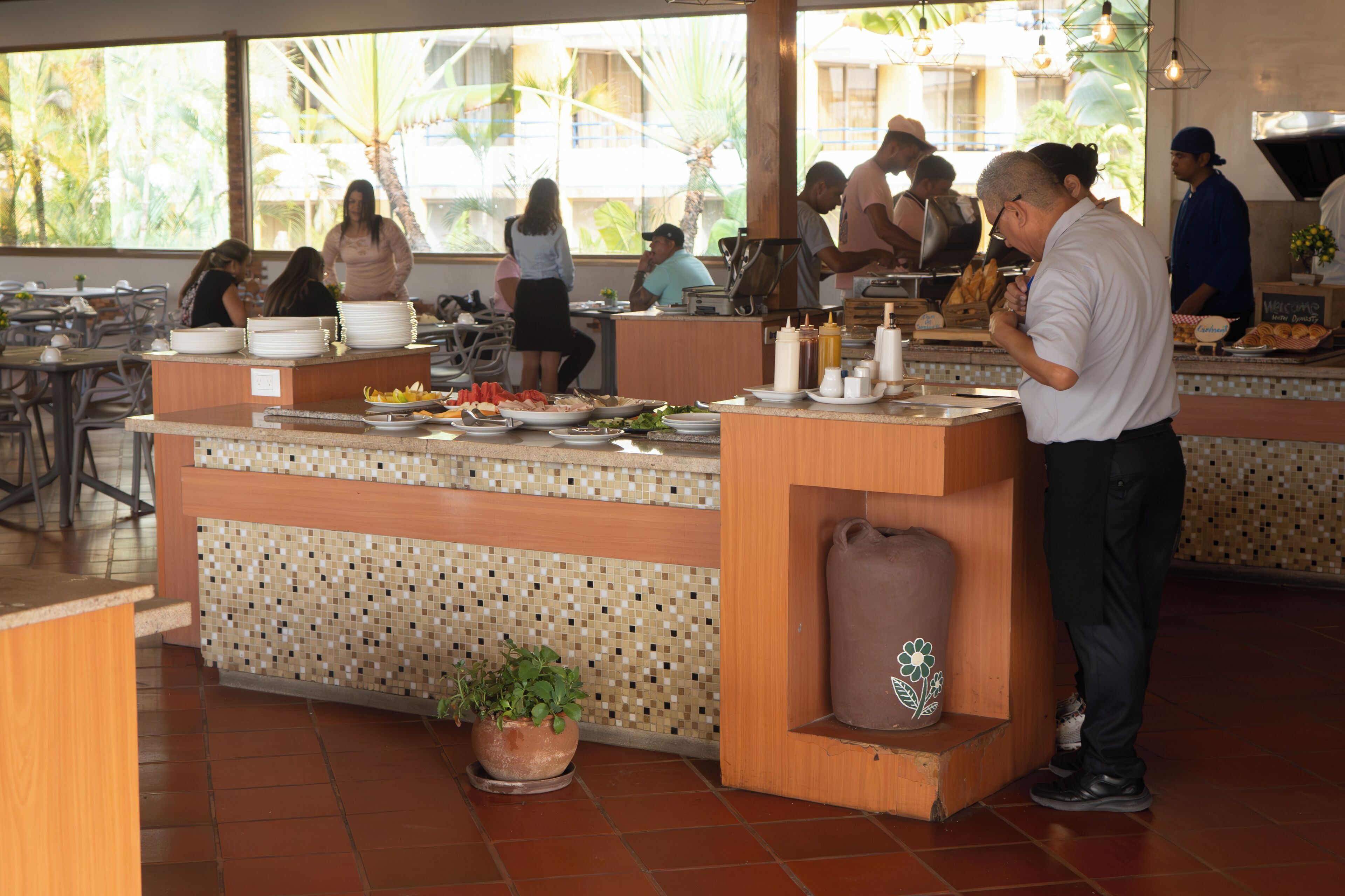 A buffet setup with a variety of food items and a coffee station.
