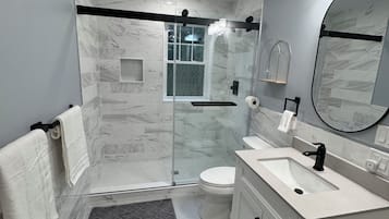 Shower, hair dryer, towels, soap
