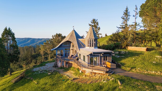 A large, multi-story house with a steeply pitched roof, a tower, and a balcony. - Marin Castle: Private Resort w Top of World Views, Hot Tub & Mini Golf, 30 Acres (Lagunitas)