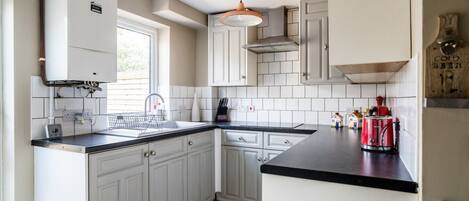 Fridge, microwave, oven, cookware/dishes/utensils