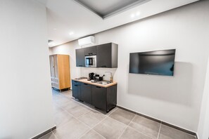 Fridge, microwave, stovetop, coffee/tea maker