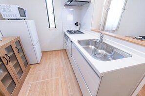 Fridge, microwave, stovetop, cookware/dishes/utensils